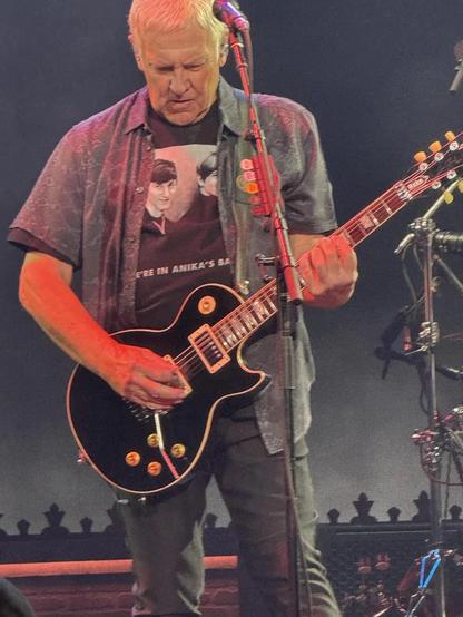 Picture of Alex Lifeson wearing the shirt on stage